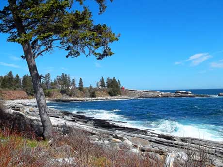 Pemequid Maine. A raging ocean surf contains negative ions which have a positive effect on mood.
