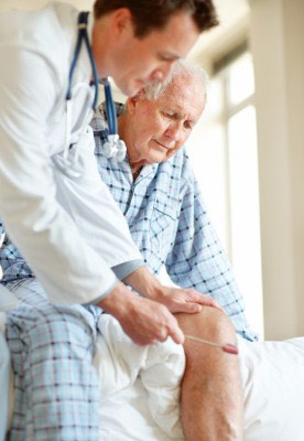 A patient with restless leg syndrome being seen by his doctor A patient with restless leg syndrome being seen by his doctor