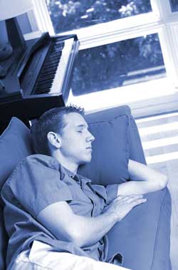 Teen with delayed sleep phase syndrome sleeping on the couch